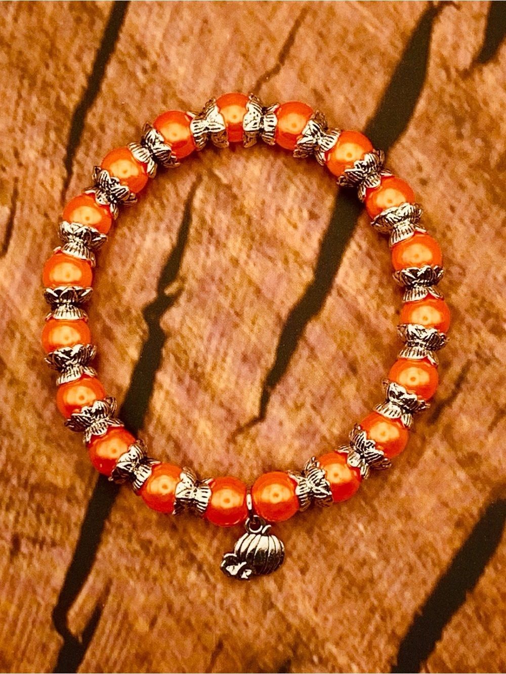 Vibrant Orange Bead Bracelet with Silver Pumpkin Charm